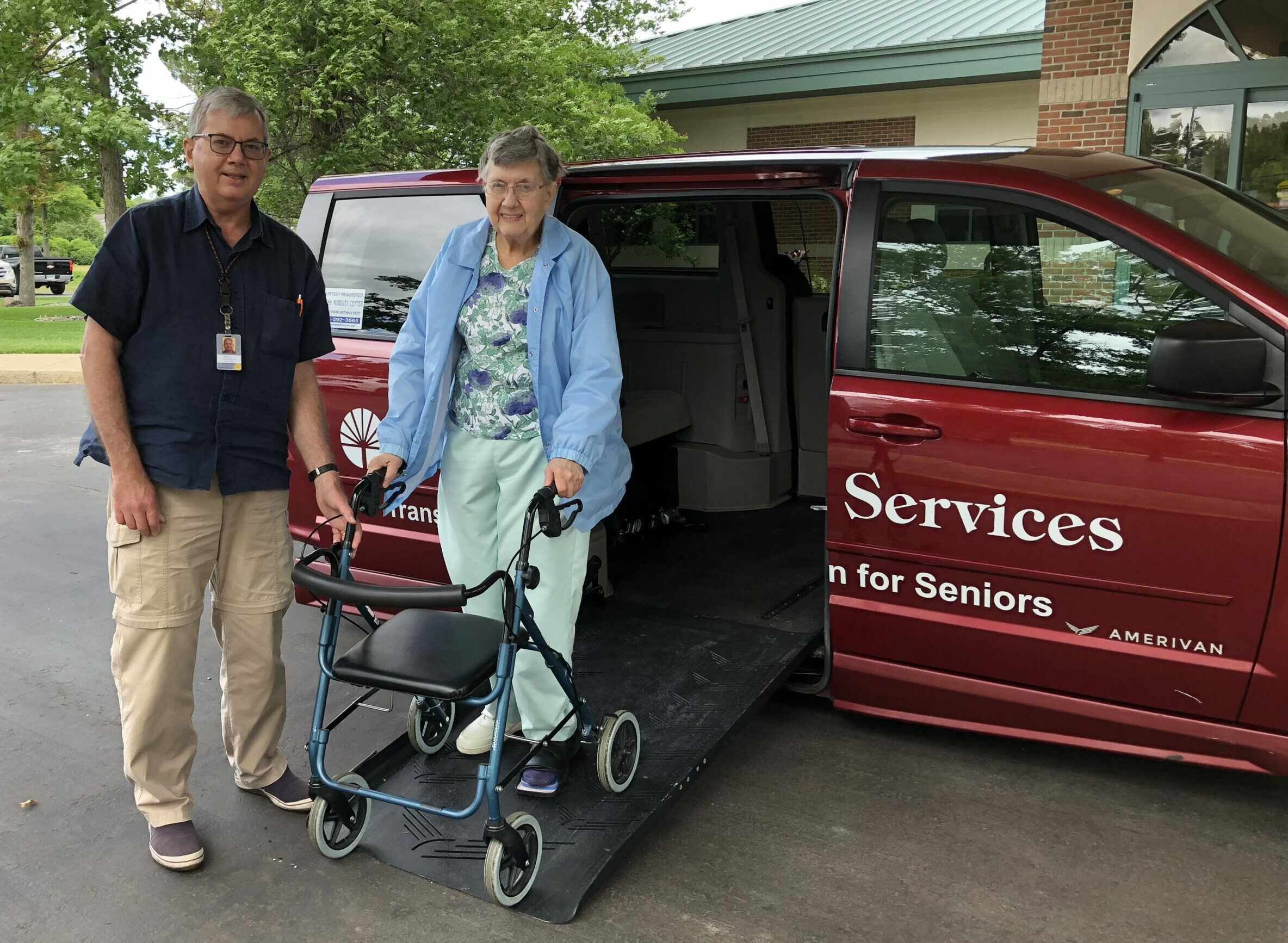 Transportation volunteer driver from Senior Services assists a client getting out of a vehicle.